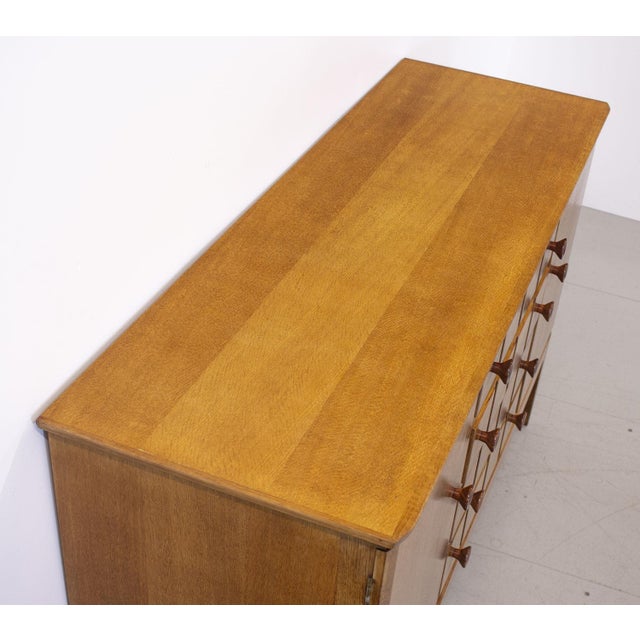 Modernist oak sideboard by Gordon Russell. Dating from the early 1950s but showing influences of the earlier Cotswold...