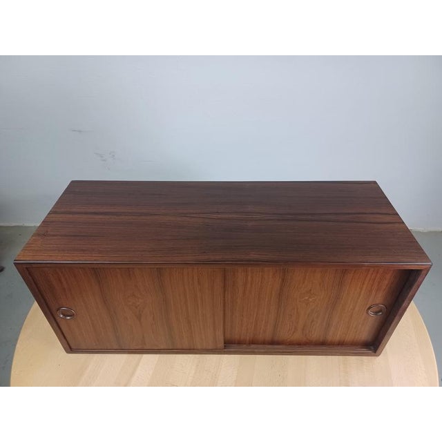 1960s Kai Kristiansen cabinet wall unit in teak by Feldballe Mobelfabrik. Teak cabinet for Kai Kristiansens classic iconic...