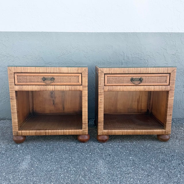 A charming pair of Boho Chic nightstands featuring warm-toned woven wicker construction and removable glass tops. Each...