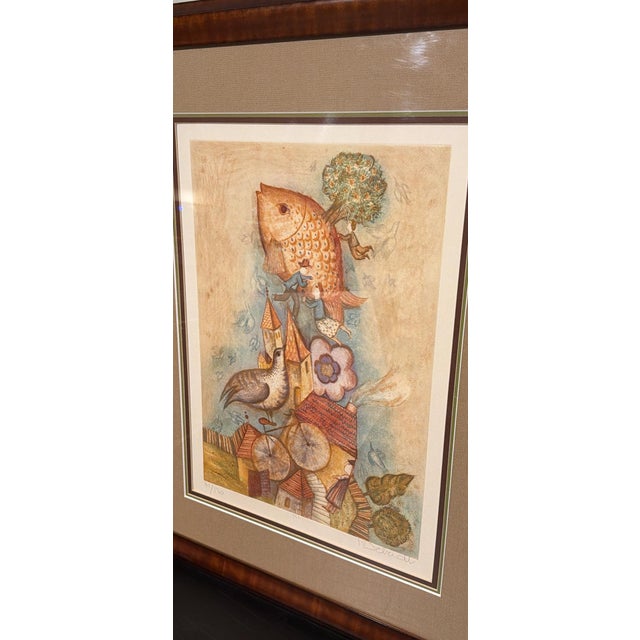 This piece is a beautiful original color etching titled "Poisson Volant" (Flying Fish) by renowned French artist Françoise...