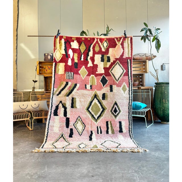 This Moroccan Boujad rug is a handwoven piece originating from the Boujad region in the Middle Atlas Mountains of Morocco....