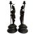 An exceptional pair of 19th-century French antique spelter figural candlesticks featuring a romanticized Renaissance-era...