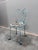 A graceful pair of hand-forged French garden chairs, each with a heart-shaped back crowned in a classic ribbon-and-scroll...