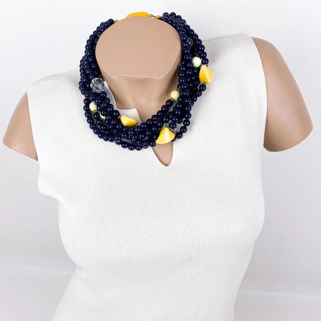 This stunning Angela Caputi, made-in-Italy resin choker necklace features a multi-strand design with a dominant black...