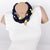 This stunning Angela Caputi, made-in-Italy resin choker necklace features a multi-strand design with a dominant black...