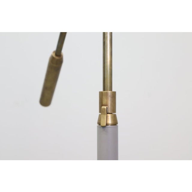 GINO SARFATTI Floor lamp model 1003, enameled metal, brass, painted aluminum, opaline. Produced by Arteluce, circa 1950....