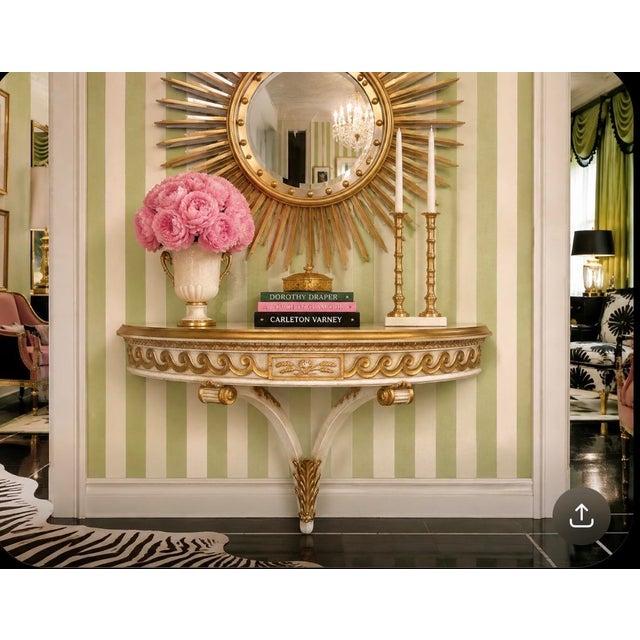 Presenting a sublime vintage Dorothy Draper Regency style wall mounted shelf with gold gilt acanthus leaf detail and...