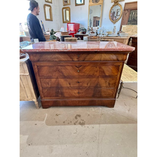 19th Century French Louis Philippe Commode from Paris France. Made of walnut, with a marble top, the wood has been...