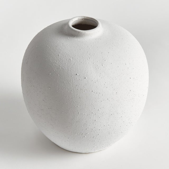 This modern cylinder style vase is perfect for the single statement branch. Made of highfired stoneware and a coldfinish...