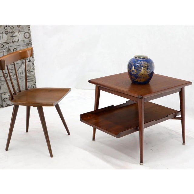 Pair of Mid-Century Modern two tier oiled walnut end side tables in stunning condition. Jens Risom Decor match.
