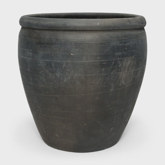 Sculpted by artisans in China's Shanxi province, this black clay vessel has a quiet simplicity, shaped with balanced...