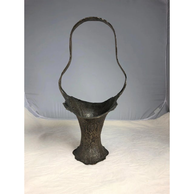 Antique wedding basket with ornate Cherub detailing. This pretty piece has an intricate design with a nice patina. A nice...