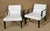 Pair of Mid-Century Modern style low chairs by the Bright Furniture Company. White leather over black wood frame. Simple...