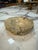 Solid marble ashtray featuring a polished bowl, multiple cigarette rests, and a rugged natural-stone exterior. Its warm...
