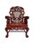 A striking antique Chinese armchair crafted from richly toned rosewood, featuring elaborate hand-carved detailing and...