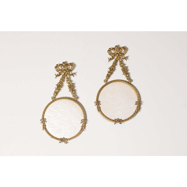 This exquisite set of two French 19th-century hanging picture frames exudes timeless elegance and charm. Crafted from gilt...