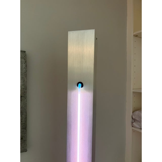 Rudi Stern for George Kovacs Neon Light Brushed stainless steel floor lamp with angled neon lighting. The light stands...
