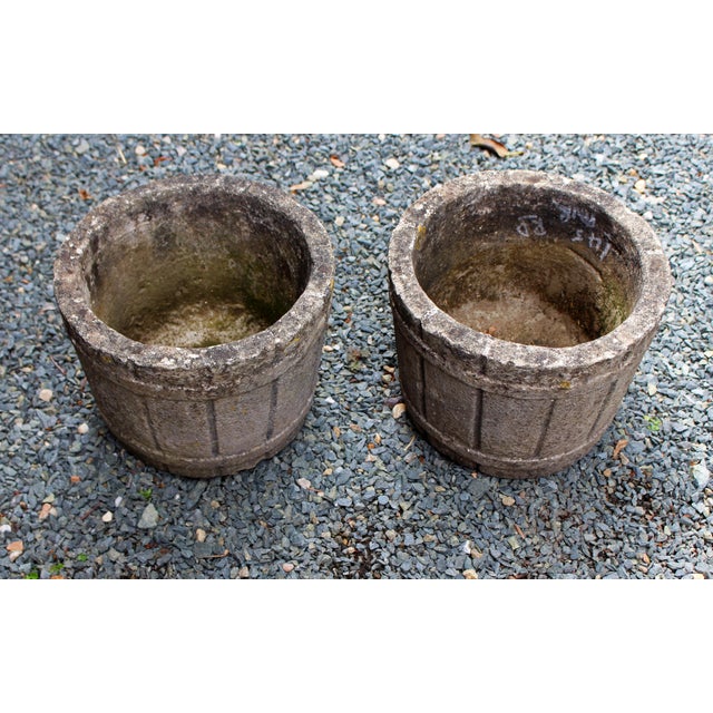 Circa 1950 Pair of cast stone barrel form planter, English. Staved barrels with double banding. Great patina! 11.5" dia.,...