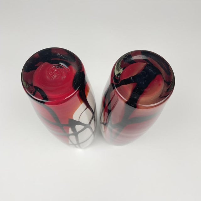Two large, hand-blown Murano glass vases with a graphic abstract pattern in red, black, and white. Circa 1980 Total...
