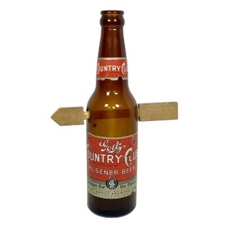 Folk Art Arrow Through Goetz Beer Bottle: Whimsical Display Piece For Sale
