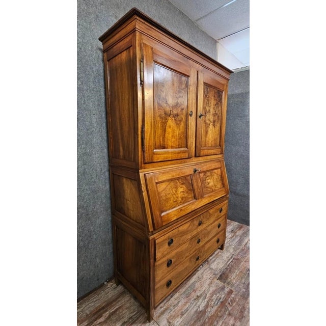 Louis XVI period three-section walnut secretary desk. Beautiful antique secretary desk in solid wood, likely fruitwood,...