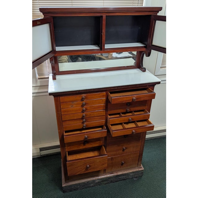 This beautiful antique Weber mahogany dental cabinet is a remarkable piece of early dental history and craftsmanship....