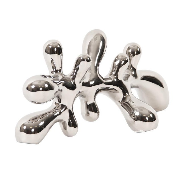 This abstract ceramic horizontal Statue has an almost liquid quality to its shape creating the most interesting movement....
