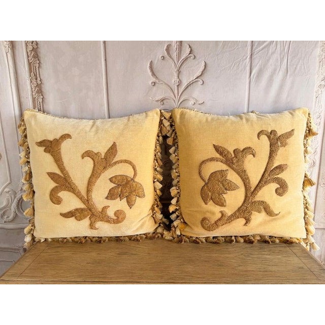 A luminous and textural pair of decorative pillows designed by Melissa Levinson, blending antique European craftsmanship...