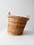 Vintage handwoven wicker basket with softly twisted side handles and a warm honey-toned patina. The organic weave and...
