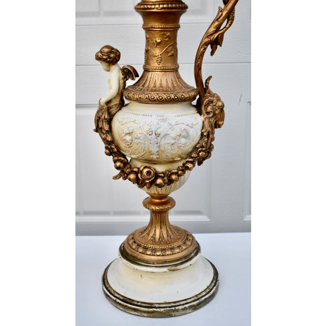 Antique (1920's) Table lamp has a Renaissance Style. The Body has anOrnate Ewer Design with Cherub, Rams Head, and a...