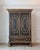A Baroque cabinet of two-part construction, circa 1760, featuring a striking black exterior and blue-painted interior. The...