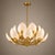 Create a stunning focal point with this Luxury Lotus Petal Brass Chandelier, beautifully crafted with layered white petal...