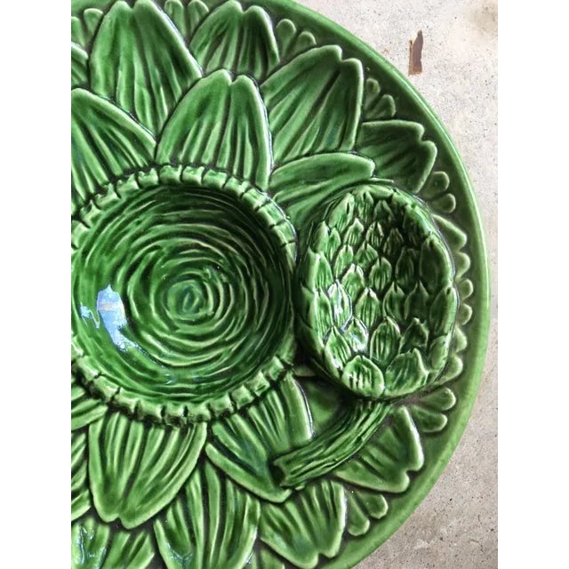 I think this is French Majolica. It is an older piece that was called an artichoke dish - note the artichoke! It has a lot...