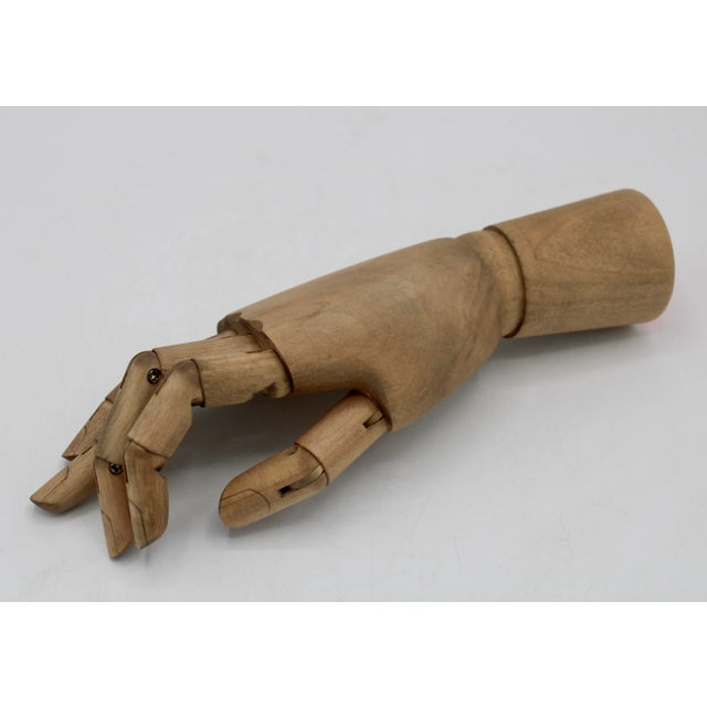 A superb 1930s Vintage French Articulated Wooden Hand. Traditionally used in French art studios, this wooden hand would...