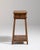 Slender oak pedestal side table in Warm Honey Oak. Its warm honey oak finish sets off single drawer, lower shelf, turned...