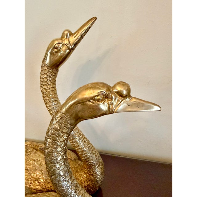 A very decorative and nicely detailed Pair of Maitland-Smith Brass Swans. With good size and fine poses, one with head...