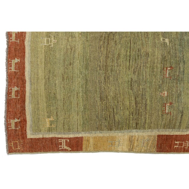 Saffron Modern Hand-Knotted Gabbeh Wool Rug – Earth Tones With Minimalist Animal Motifs For Sale - Image 8 of 8
