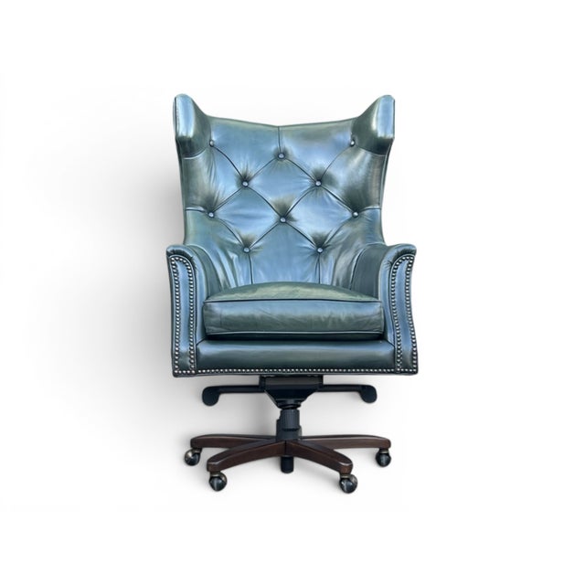 A timeless blend of English craftsmanship and executive comfort, this vintage wingback chair makes a distinguished...