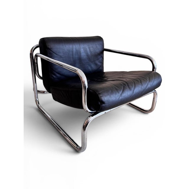 Designed by british designer rodney kinsman for his company omk, the t2 armchair reflects the era’s “high-tech” design...