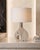 A striking and sculptural vintage table lamp base, masterfully crafted from solid travertine and designed in the form of a...