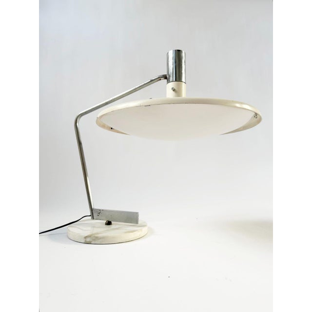 A rare table lamp designed by georges frydman around 1961 and produced by efa in nice during the 1960s. the lamp is...