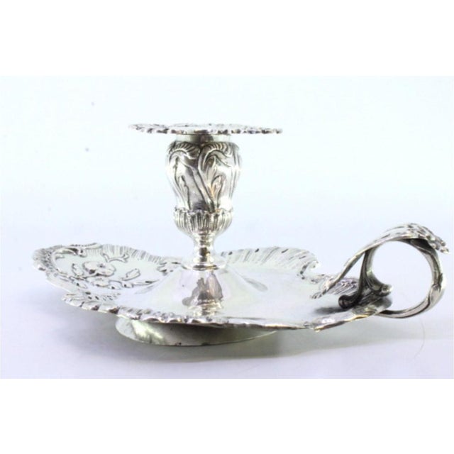 Silver Paddle with Applications and Raised Floral Motifs, in Very Good conditions. Designed 1890 to 1919 This piece has an...