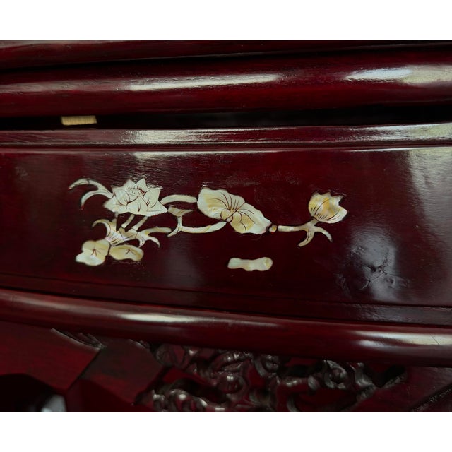 Striking vintage Chinese-style carved lacquer display cabinet featuring an ornate openwork crest, intricate carved...