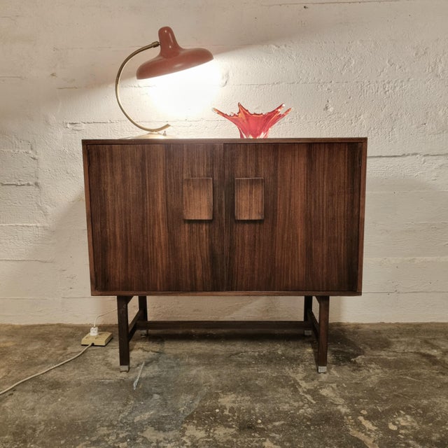 Special wall cabinet designed by the Danish artist Inger Klingenberg and produced by Fristho Franeker, 1960s. The two...