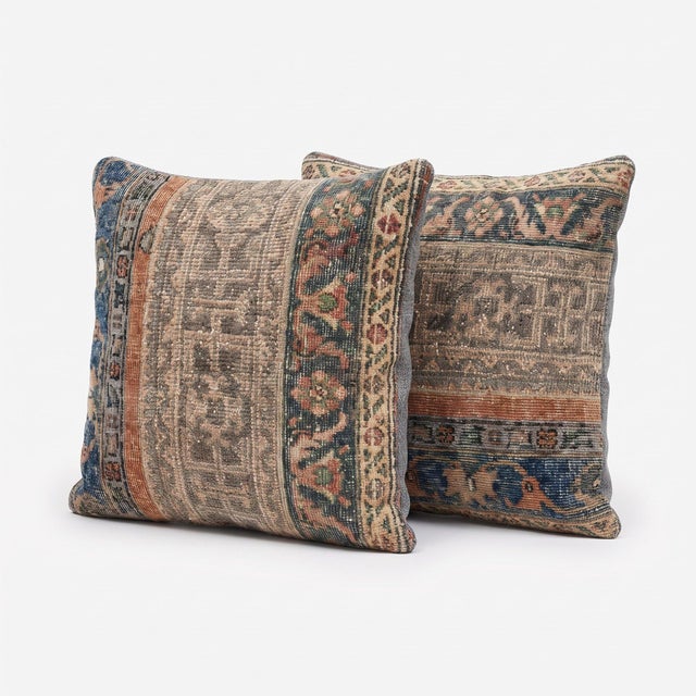 This 24'' x 24'' pillow cover set was made from authentic Turkish rug pieces — faded indigo and salmon stripes on pale...