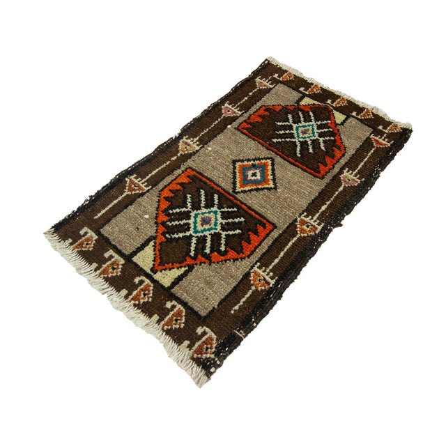 Vintage Handknotted decorative mini rug from Kars region of Turkey. Approximately 45-55 years old. In very good condition.