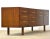 A mid century modern long credenza with brass drawer pulls designed by Jens Risom. Two drawers for hanging files....
