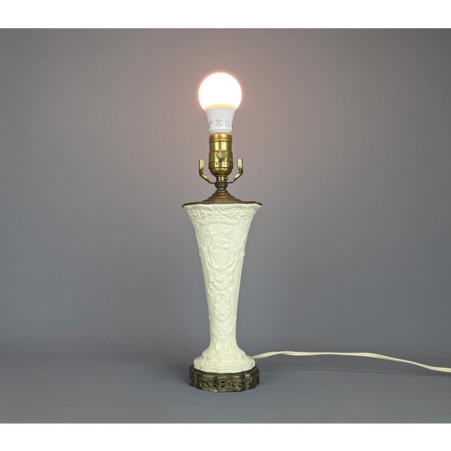 Antique Wedgwood Ceramic and Bronze Lamp An elegant table lamp by Wedgwood features a delicate floral design with...