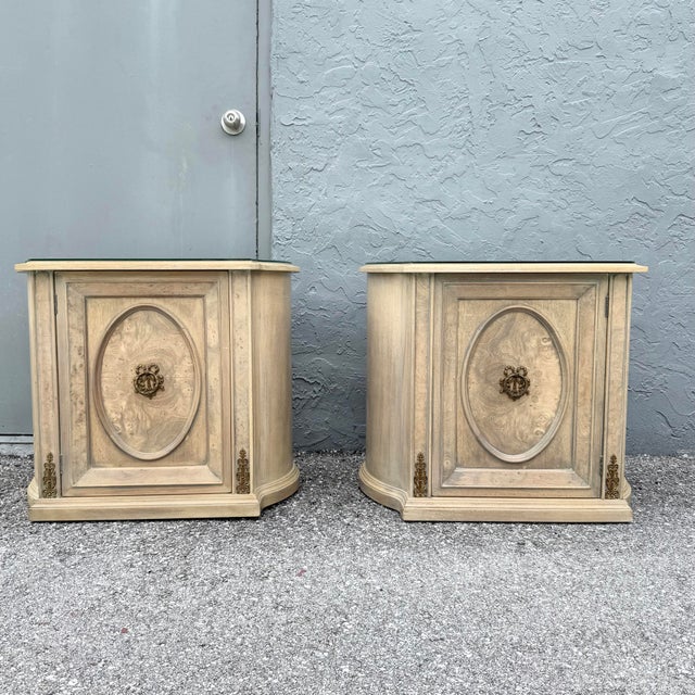 Elegant pair of vintage French Provincial nightstands by Detroit Furniture, featuring softly distressed cream finishes...