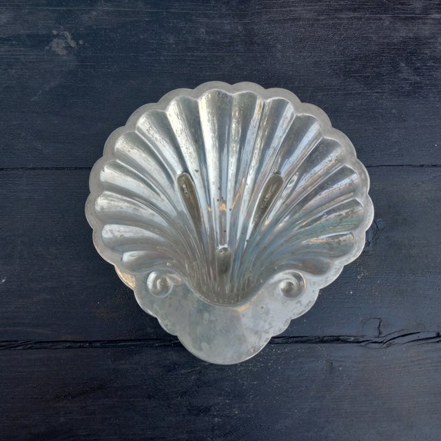 This Clam Shell Bon Bon Trinket tray is marked "S. Kirk & Sons" which places its creation around the late late 1890s. Also...